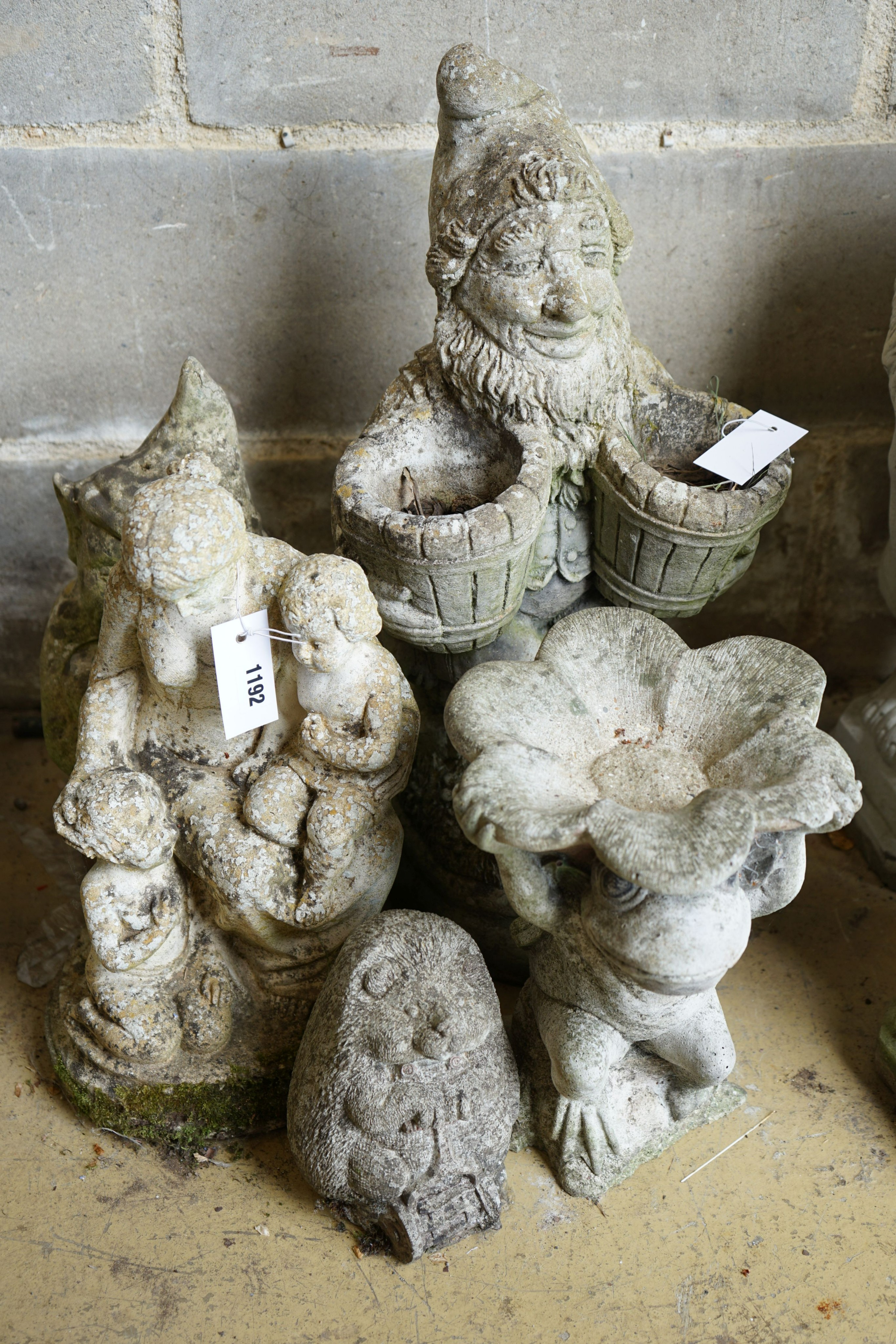 Five reconstituted stone garden ornaments, largest height 55cm